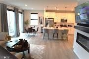 living area featuring a wealth of natural light and wood finished floors