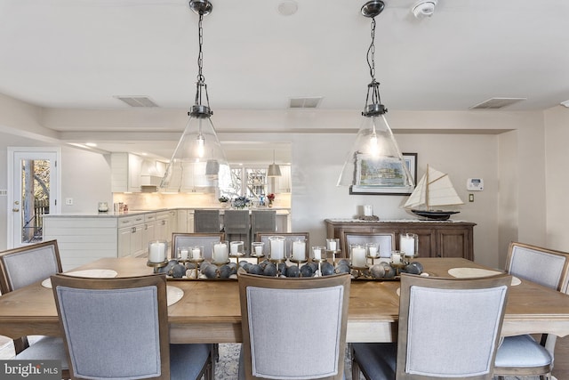 dining room with visible vents and plenty of natural light