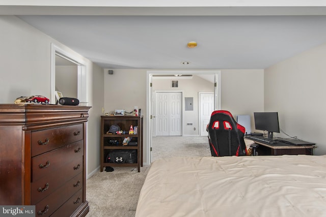 bedroom featuring light carpet, baseboards, and electric panel