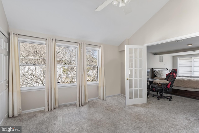 interior space featuring lofted ceiling, french doors, baseboards, and carpet floors