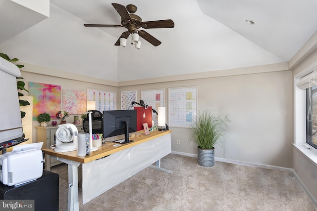 home office with a ceiling fan, lofted ceiling, carpet, and baseboards