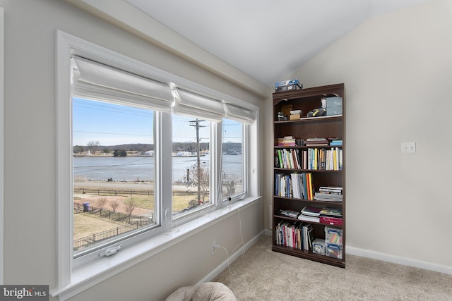 sitting room with baseboards, lofted ceiling, and carpet flooring