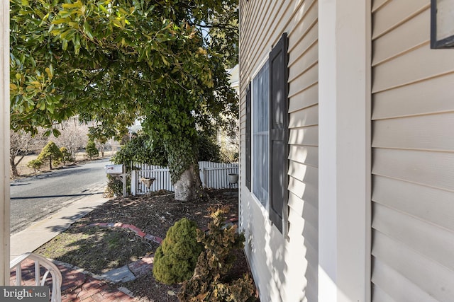 view of home's exterior featuring fence