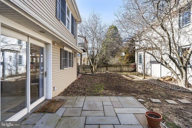 view of yard featuring a patio area and fence