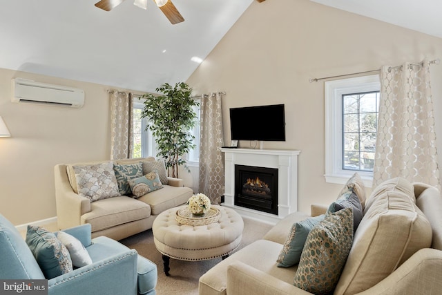 living room with a warm lit fireplace, high vaulted ceiling, a ceiling fan, and a wall unit AC