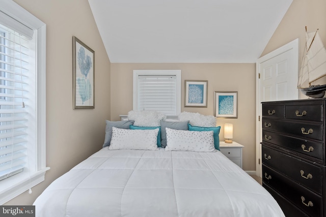 bedroom featuring lofted ceiling