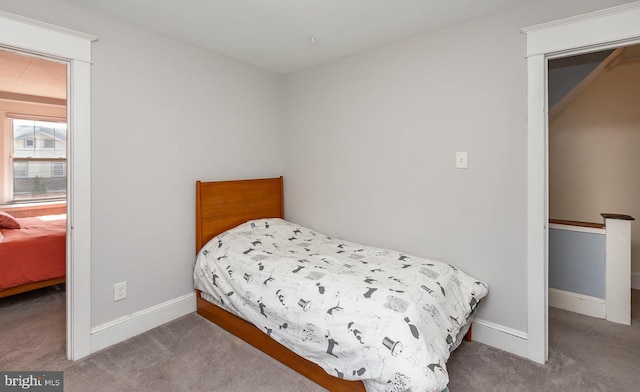 carpeted bedroom with baseboards