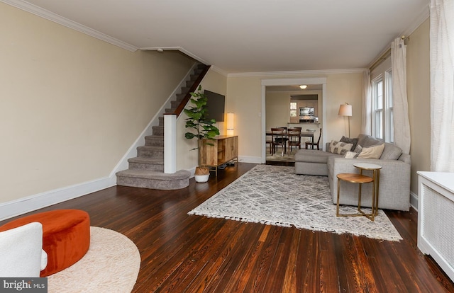 living room featuring ornamental molding, stairs, baseboards, and wood finished floors