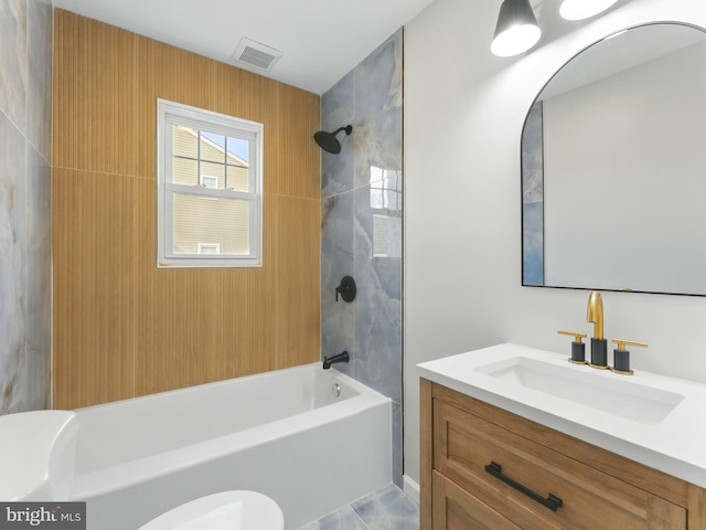 full bathroom with visible vents, toilet, shower / bath combination, and vanity