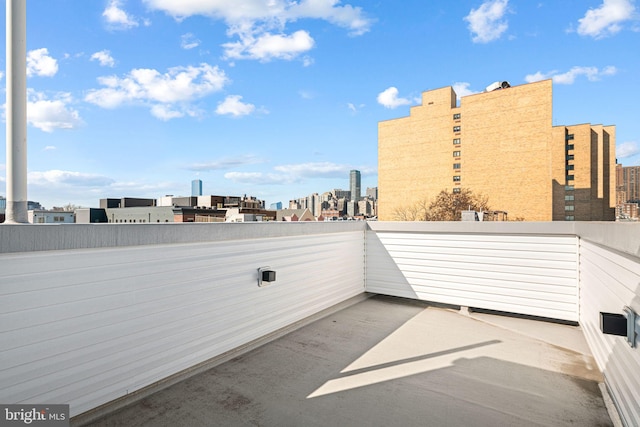 view of patio featuring a city view and a balcony