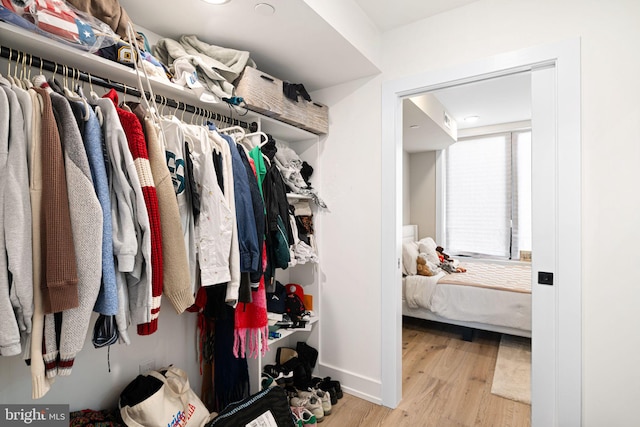 spacious closet with wood finished floors