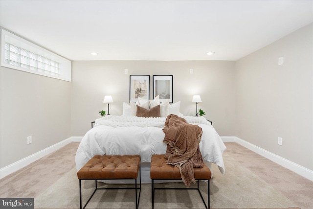 bedroom featuring recessed lighting, light colored carpet, and baseboards