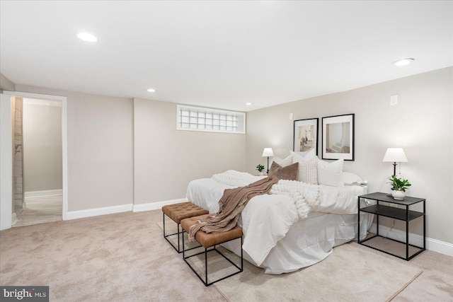 carpeted bedroom featuring recessed lighting and baseboards