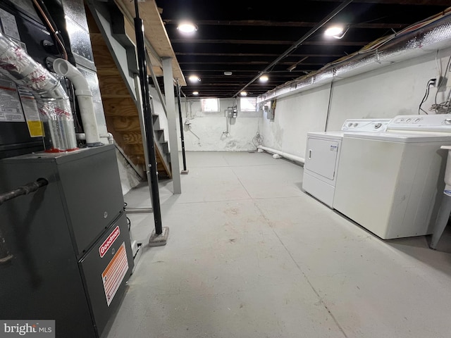 below grade area with washing machine and clothes dryer