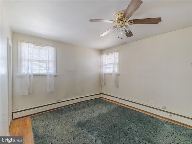 unfurnished room with wood finished floors and a ceiling fan