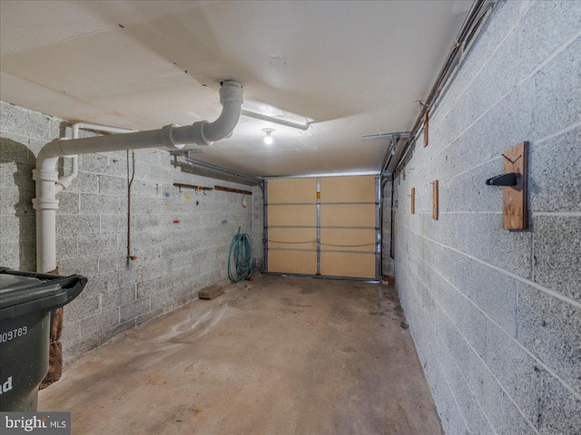 garage featuring concrete block wall