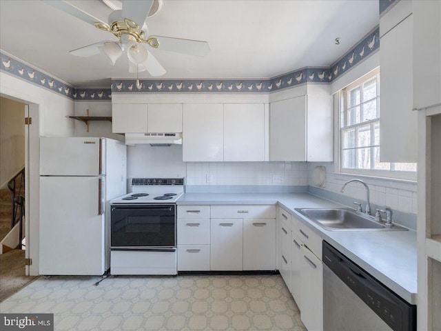 kitchen with electric range, freestanding refrigerator, a sink, under cabinet range hood, and dishwasher