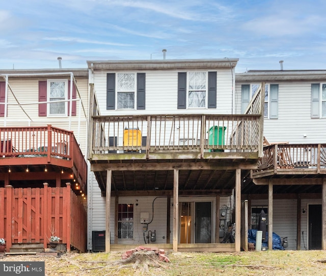 rear view of property featuring a deck