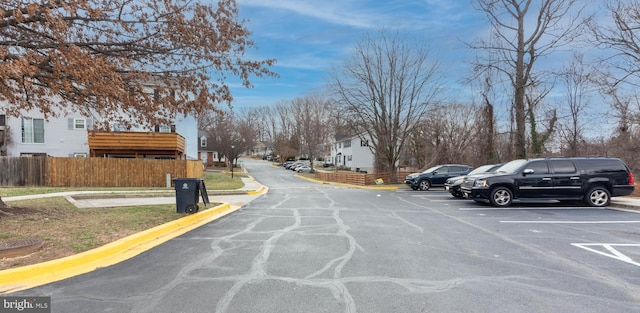 view of road with curbs and a residential view