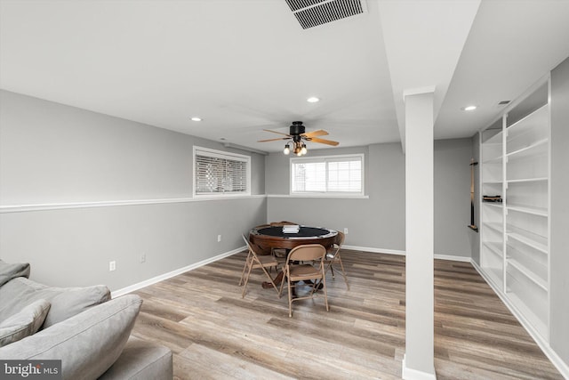 dining space with recessed lighting, wood finished floors, visible vents, and baseboards