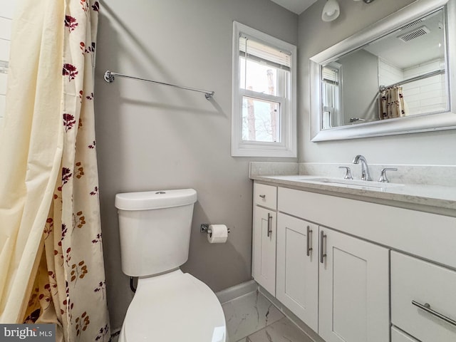 bathroom with visible vents, toilet, marble finish floor, baseboards, and vanity