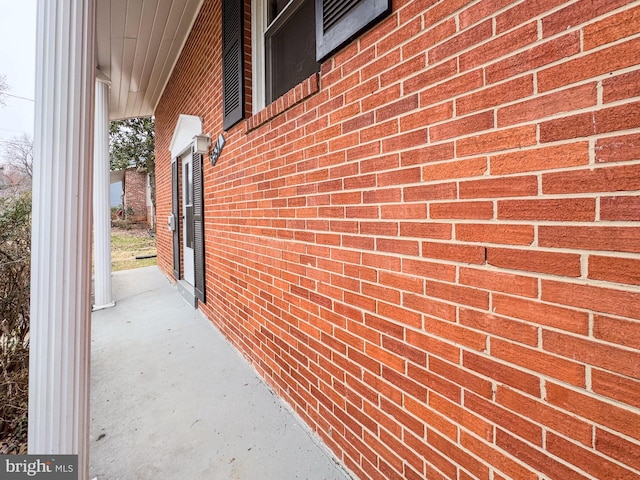 view of side of property with brick siding