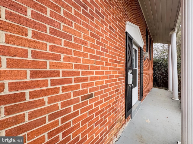 exterior space with brick siding