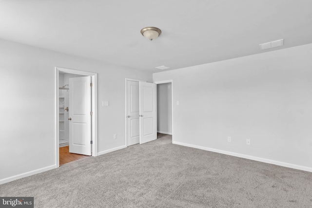 unfurnished bedroom featuring baseboards and carpet floors