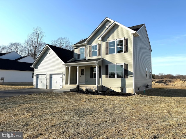 traditional home with a porch and driveway