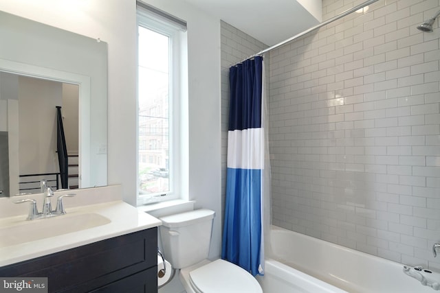 bathroom with vanity, toilet, and shower / tub combo with curtain