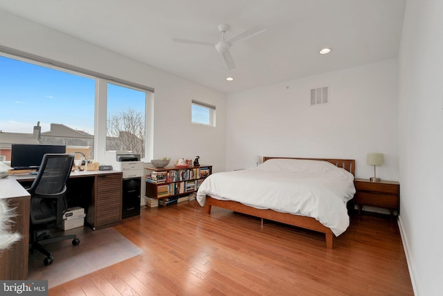 bedroom with visible vents, recessed lighting, light wood-style floors, baseboards, and ceiling fan