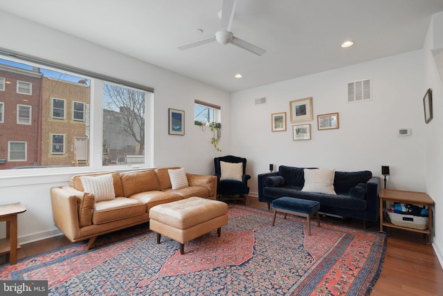 living area with recessed lighting, visible vents, wood finished floors, and a ceiling fan