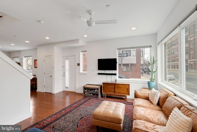 living room featuring a wealth of natural light, recessed lighting, and wood finished floors