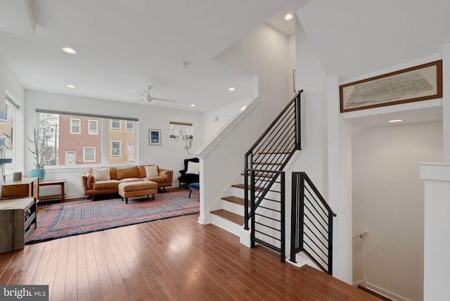 living room with a ceiling fan, recessed lighting, wood finished floors, and baseboards