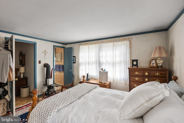 bedroom with crown molding