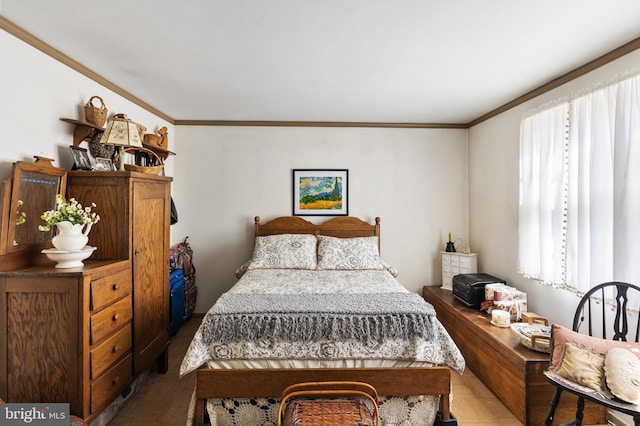 bedroom with multiple windows and crown molding