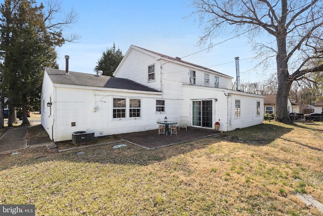 back of property with a patio, a yard, and cooling unit