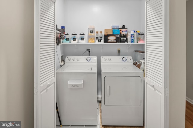 laundry area featuring separate washer and dryer and laundry area