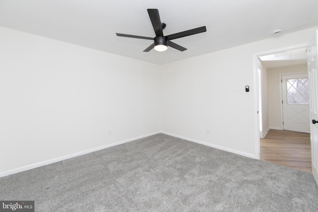 unfurnished room featuring ceiling fan, baseboards, and carpet floors