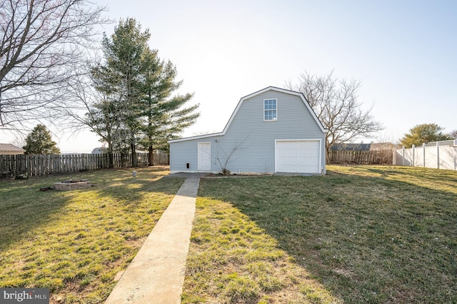 exterior space with a detached garage and fence