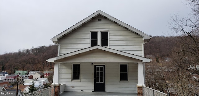 view of front of house with fence