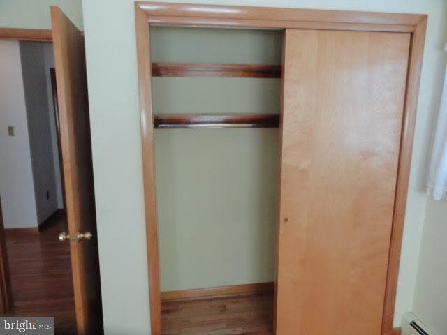 closet featuring a baseboard heating unit