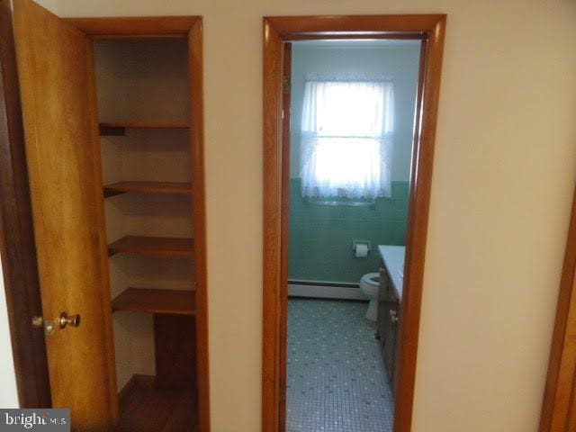 hallway with a baseboard radiator