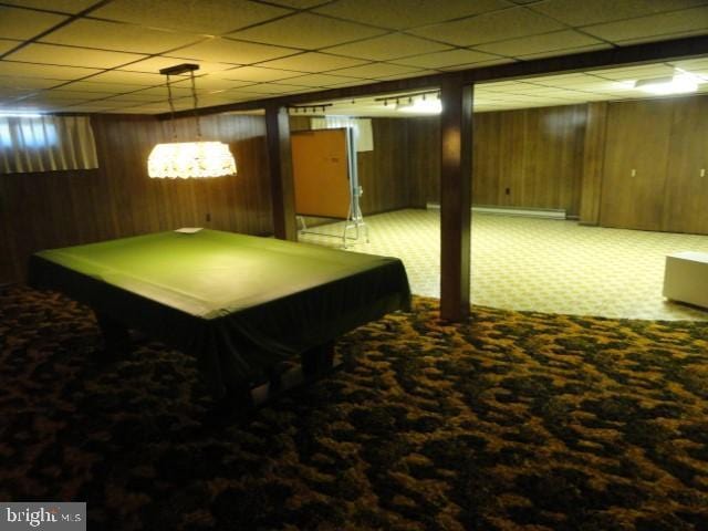 rec room featuring a drop ceiling, carpet floors, wooden walls, and pool table