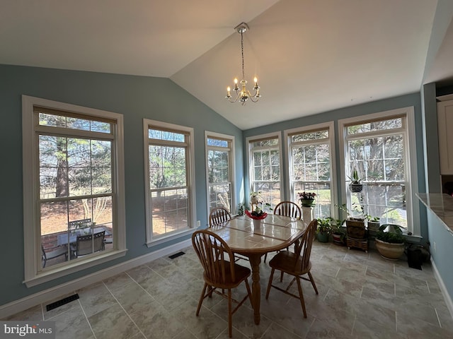 dining room with baseboards, visible vents, lofted ceiling, and an inviting chandelier