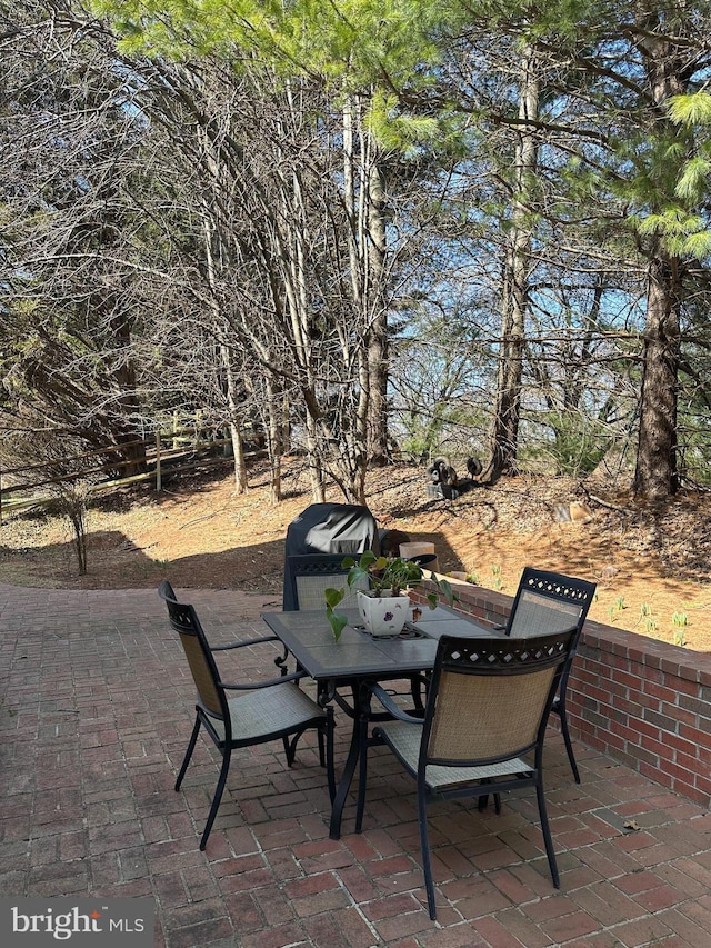 view of patio featuring outdoor dining area