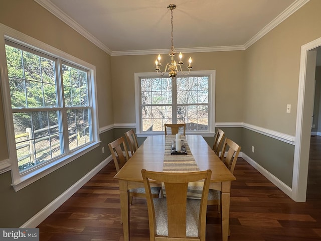 dining room featuring crown molding, a notable chandelier, baseboards, and dark wood-style flooring