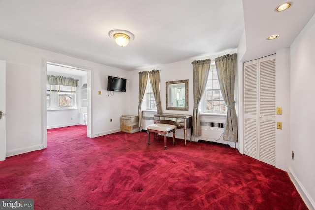 unfurnished room with recessed lighting, carpet, a healthy amount of sunlight, and baseboards