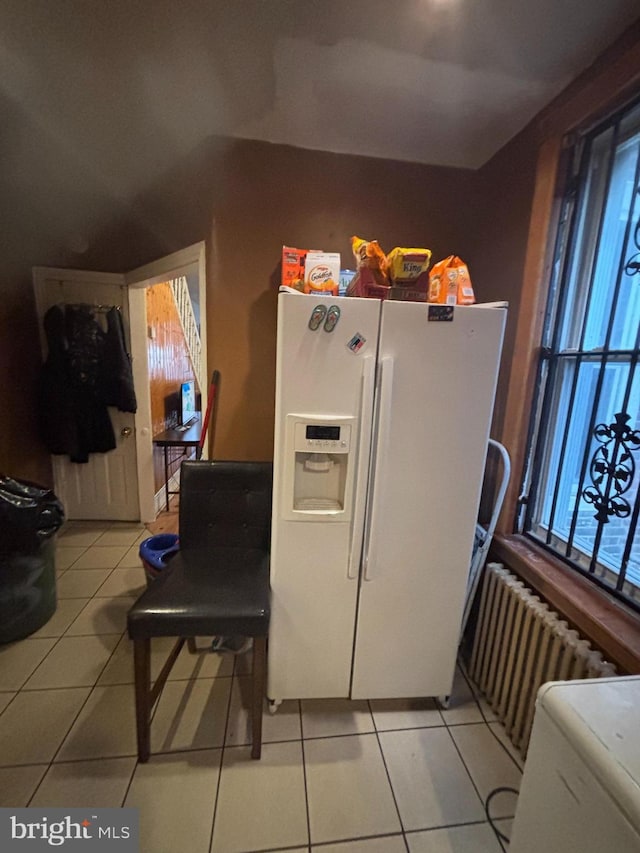 3316 Jasper St, Philadelphia, PA 19134 - kitchen with light tile patterned floors, white refrigerator with ice dispenser, and radiator heating unit