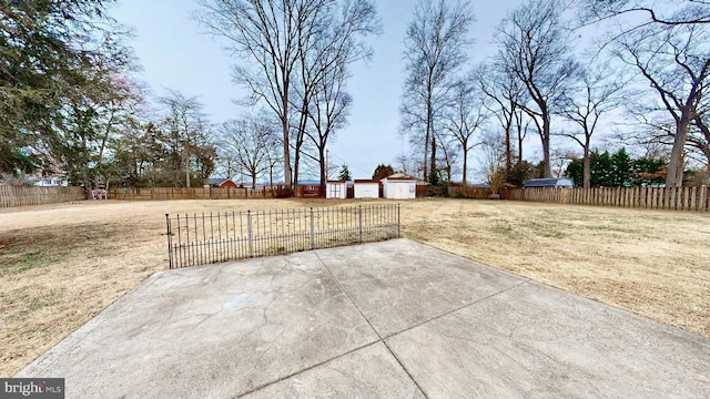 view of patio / terrace featuring an outdoor structure and fence private yard